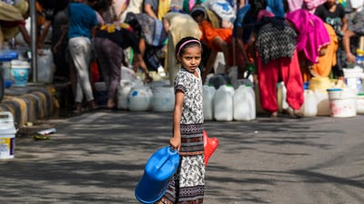 New Delhi: A child waits to collect water from a municipality tanker, at Chanakyapuri area in New Delhi, Thursday, June, 6, 2024. (PTI Photo/Kamal Singh) (PTI) New Delhi: A child waits to collect water from a municipality tanker, at Chanakyapuri area in New Delhi, Thursday, June, 6, 2024. (PTI Photo/Kamal Singh) (PTI)