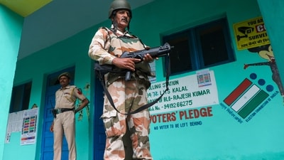 Rajouri: Security personnel stand guard outside a polling booth near Line on Control (LOC) ahead of the second phase election of Jammu and Kashmir Assembly (PTI Photo) (PTI) Rajouri: Security personnel stand guard outside a polling booth near Line on Control (LOC) ahead of the second phase election of Jammu and Kashmir Assembly (PTI Photo) (PTI)
