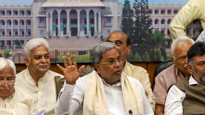 Karnataka Chief Minsiter Siddaramaiah with his Deputy DK Shivakumar addresses a press conference after Karnataka High Court dismissed his petition challenging the approval given by Governor Thaawarchand Gehlot for an investigation against him in the MUDA site allotment case, in Bengaluru. (PTI) Karnataka Chief Minsiter Siddaramaiah with his Deputy DK Shivakumar addresses a press conference after Karnataka High Court dismissed his petition challenging the approval given by Governor Thaawarchand Gehlot for an investigation against him in the MUDA site allotment case, in Bengaluru. (PTI)