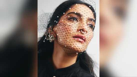 She accessorised her look with a pair of chunky silver statement earrings, a septum nose ring, and a black netted mask adorned with pearls, adding an extra dose of glamour.(Instagram/@rheakapoor)