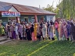Voters wait in queues to cast their votes for the second phase of the Jammu and Kashmir Assembly elections in Budgam on Wednesday. 