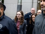 Caroline Ellison, former chief executive officer of Alameda Research LLC, center, exits court in New York, US.