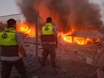 Rescuers rush to the scene of an Israeli airstrike that targeted the southern Lebanese village of Abbasiyeh on September 24, 2024. Rescuers rush to the scene of an Israeli airstrike that targeted the southern Lebanese village of Abbasiyeh on September 24, 2024.