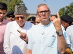 Srinagar: Jammu and Kashmir National Conference (JKNC) President Farooq Abdullah and Vice President Omar Abdullah show their fingers marked with indelible ink after casting vote during the second phase of Jammu and Kashmir Assembly elections, in Srinagar, Wednesday. Srinagar: Jammu and Kashmir National Conference (JKNC) President Farooq Abdullah and Vice President Omar Abdullah show their fingers marked with indelible ink after casting vote during the second phase of Jammu and Kashmir Assembly elections, in Srinagar, Wednesday.