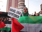 Demonstrators hold Palestinian flags during a gathering called in support of Lebanon, in Madrid on September 25, 2024. (Photo by Thomas COEX / AFP)