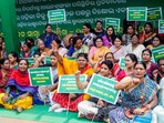 Biju Janata Dal (BJD) women's wing members hold placards as they stage a sit-in protest in front of the Raj Bhavan against the alleged sexual assault on a woman in police custody and demanding a court-monitored SIT probe and judicial inquiry into the alleged torture of an army officer and his fiancée at Bharatpur Police Station, in Bhubaneswar on Saturday. (ANI Photo) Biju Janata Dal (BJD) women's wing members hold placards as they stage a sit-in protest in front of the Raj Bhavan against the alleged sexual assault on a woman in police custody and demanding a court-monitored SIT probe and judicial inquiry into the alleged torture of an army officer and his fiancée at Bharatpur Police Station, in Bhubaneswar on Saturday. (ANI Photo)