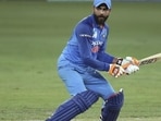 Ravindra Jadeja attempts a run as Afghanistan's wicketkeeper Mohammad Shahzad (left) runs to field the ball in a 2018 Asia Cup match. Ravindra Jadeja attempts a run as Afghanistan's wicketkeeper Mohammad Shahzad (left) runs to field the ball in a 2018 Asia Cup match.