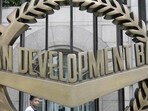A worker walks past inside the Asian Development Bank (ADB) headquarters in Manila.