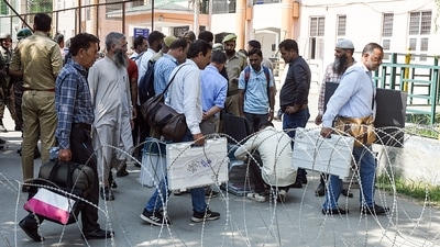 Polling officials carrying electronic voting machines (EVMs) and other election materials leave for their respective polling stations on the eve of the second phase of Jammu and Kashmir Assembly elections, at a distribution centre in Srinagar, on Tuesday. (ANI Photo) Polling officials carrying electronic voting machines (EVMs) and other election materials leave for their respective polling stations on the eve of the second phase of Jammu and Kashmir Assembly elections, at a distribution centre in Srinagar, on Tuesday. (ANI Photo)