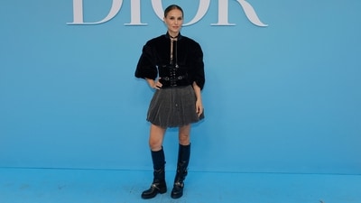 Natalie Portman also wore a striking Dior Cruise 2025 look for the show. It features an embellished mini skirt and a corset black velvet jacket styled with custom vegan boots, a choker necklace, and a centre-parted sleek bun. (AFP) Natalie Portman also wore a striking Dior Cruise 2025 look for the show. It features an embellished mini skirt and a corset black velvet jacket styled with custom vegan boots, a choker necklace, and a centre-parted sleek bun. (AFP)