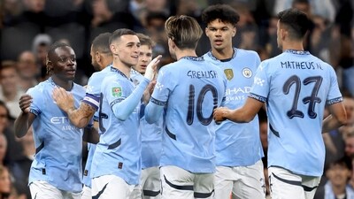 Manchester City's Belgian midfielder #11 Jeremy Doku (L) celebrates scoring the team's first goal during the English League Cup third round (AFP) Manchester City's Belgian midfielder #11 Jeremy Doku (L) celebrates scoring the team's first goal during the English League Cup third round (AFP)
