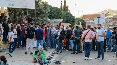 People fleeing Israeli bombings in Lebanon which killed more than 569 people. (Photo by Hassan JARRAH / AFP) (AFP) People fleeing Israeli bombings in Lebanon which killed more than 569 people. (Photo by Hassan JARRAH / AFP) (AFP)