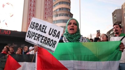 Demonstrators hold Palestinian flags during a gathering called in support of Lebanon, in Madrid on September 25, 2024. (Photo by Thomas COEX / AFP) (AFP) Demonstrators hold Palestinian flags during a gathering called in support of Lebanon, in Madrid on September 25, 2024. (Photo by Thomas COEX / AFP) (AFP)