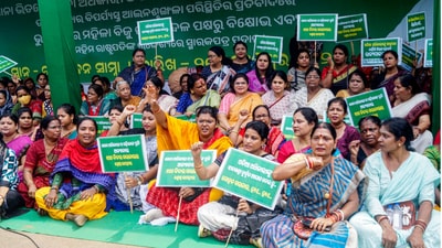 Biju Janata Dal (BJD) women's wing members hold placards as they stage a sit-in protest in front of the Raj Bhavan against the alleged sexual assault on a woman in police custody and demanding a court-monitored SIT probe and judicial inquiry into the alleged torture of an army officer and his fiancée at Bharatpur Police Station, in Bhubaneswar on Saturday. (ANI Photo) Biju Janata Dal (BJD) women's wing members hold placards as they stage a sit-in protest in front of the Raj Bhavan against the alleged sexual assault on a woman in police custody and demanding a court-monitored SIT probe and judicial inquiry into the alleged torture of an army officer and his fiancée at Bharatpur Police Station, in Bhubaneswar on Saturday. (ANI Photo)