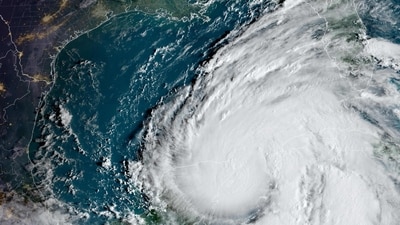 This image obtained from the National Oceanic and Atmospheric Administration (NOAA) shows Tropical Storm Helene on September 25, 2024, at 13:11 UTC. Florida on September 24 started preparing for Helene, due to make landfall later in the week as a powerful Category 3 hurricane. Helene, currently churning over the Caribbean with maximum sustained winds of 50 miles (85kms) per hour, is projected to rapidly strengthen through the Gulf of Mexico before slamming into the Florida coast on September 26, according to the National Hurricane Center. (AFP) This image obtained from the National Oceanic and Atmospheric Administration (NOAA) shows Tropical Storm Helene on September 25, 2024, at 13:11 UTC. Florida on September 24 started preparing for Helene, due to make landfall later in the week as a powerful Category 3 hurricane. Helene, currently churning over the Caribbean with maximum sustained winds of 50 miles (85kms) per hour, is projected to rapidly strengthen through the Gulf of Mexico before slamming into the Florida coast on September 26, according to the National Hurricane Center. (AFP)