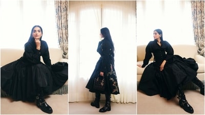 Sonam Kapoor wore a black number from Dior's Cruise 2025 collection to attend their Spring Summer 2025 show. The outfit comprised of a tailored black trench coat embellished with delicate floral embroidery on the shoulder with a voluminous skirt and structured corset. Barely-there makeup with flushed cheeks, half-tied hairdo, oxidised silver jewellery, boots, and a septum ring rounded off the styling. Sonam Kapoor wore a black number from Dior's Cruise 2025 collection to attend their Spring Summer 2025 show. The outfit comprised of a tailored black trench coat embellished with delicate floral embroidery on the shoulder with a voluminous skirt and structured corset. Barely-there makeup with flushed cheeks, half-tied hairdo, oxidised silver jewellery, boots, and a septum ring rounded off the styling. 