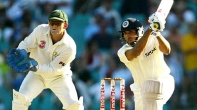 VVS Laxman (L) drives as Australian wicketkeeper Adam Gilchrist (L) looks on, on the first day of the fourth Test Match against India in Sydney 02 January 2004. (AFP)