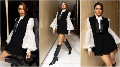 Samantha's latest look is the definition of chic. She turned heads in a black waistcoat layered over a white mini dress with puffed sleeves. Paired with black leather thigh-high boots, she exudes glamour. (Instagram/@samantharuthprabhuoffl) Samantha's latest look is the definition of chic. She turned heads in a black waistcoat layered over a white mini dress with puffed sleeves. Paired with black leather thigh-high boots, she exudes glamour. (Instagram/@samantharuthprabhuoffl)