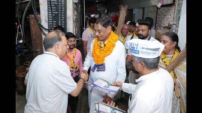 AAP candidate Prem Garg interacting with voters in Panchkula. (Sant Arora/Hindustan Times)