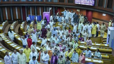 Councillors of the BJP and AAP raise slogans against one another over an impasse on mobile phones being allowed in the chamber. (PTI) Councillors of the BJP and AAP raise slogans against one another over an impasse on mobile phones being allowed in the chamber. (PTI)