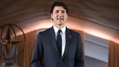 (FILES) Canadian Prime Minister Justin Trudeau arrives for the NATO 75th Anniversary Celebratory Event at the Mellon Auditorium in Washington, DC, on July 9, 2024. Canadian Prime Minister Justin Trudeau on September 25, 2024 survived a vote of no confidence, with 211 lawmakers opposing and 120 in favor, in the first major test of his minority Liberal government (Photo by Brendan SMIALOWSKI / AFP) (AFP) (FILES) Canadian Prime Minister Justin Trudeau arrives for the NATO 75th Anniversary Celebratory Event at the Mellon Auditorium in Washington, DC, on July 9, 2024. Canadian Prime Minister Justin Trudeau on September 25, 2024 survived a vote of no confidence, with 211 lawmakers opposing and 120 in favor, in the first major test of his minority Liberal government (Photo by Brendan SMIALOWSKI / AFP) (AFP)