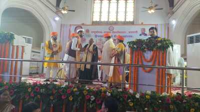 Governor Anandiben Patel giving away degrees to students during convocation ceremony of Sampurnanand Sanskrit University on Thursday. (HT)