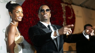 Sean "P. Diddy" Combs directs photographers as they sing "Happy Birthday," to him as his date Kim Porter, left, listens, after Combs arrived for his 35th birthday celebration at Cipriani on Wall Street in New York, Nov. 4, 2004. (AP) Sean "P. Diddy" Combs directs photographers as they sing "Happy Birthday," to him as his date Kim Porter, left, listens, after Combs arrived for his 35th birthday celebration at Cipriani on Wall Street in New York, Nov. 4, 2004. (AP)