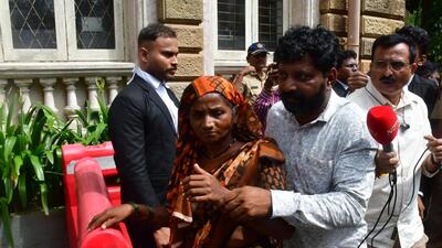 Mumbai, India – Sep 25, 2024: Badlapur sexual assault accused Akshay Shinde's father Anna Shinde and mother outside High Court that it appears from the record that Akshay Shinde was shot dead at point-blank range, in Mumbai, India, on Wednesday, Sept 25, 2024. (Photo by Bhushan Koyande/HT Photo) Mumbai, India – Sep 25, 2024: Badlapur sexual assault accused Akshay Shinde's father Anna Shinde and mother outside High Court that it appears from the record that Akshay Shinde was shot dead at point-blank range, in Mumbai, India, on Wednesday, Sept 25, 2024. (Photo by Bhushan Koyande/HT Photo)