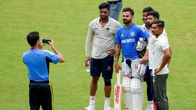 India's Virat Kohli with young cricketers during a training session ahead of the 2nd Test in Kanpur (PTI) India's Virat Kohli with young cricketers during a training session ahead of the 2nd Test in Kanpur (PTI)