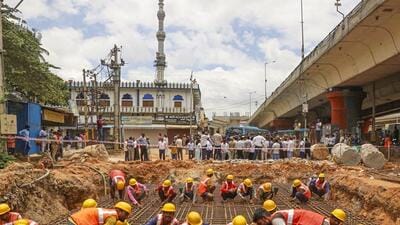 Workers at the site of construction of expansion of the Hebbal flyover, being built in an effort to reduce traffic congestion in Bengaluru on Sept 12 (PTI FILE PHOTO)