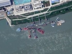 This satellite image from Planet Labs PBC shows what appears to be a sunken Chinese submarine at a shipyard near Wuhan, China, June 15, 2024. (Planet Labs PBC via AP)