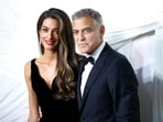 US actor George Clooney (R) and his wife Lebanese-British barrister Amal Clooney arrive for "The Albies" hosted by the Clooney Foundation for Justice at the New York Public Library in New York, September 26, 2024. (Photo by John Lamparski / AFP)