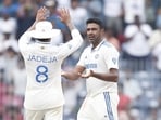 Ashwin celebrating a wicket with Ravindra Jadeja. Ashwin celebrating a wicket with Ravindra Jadeja.