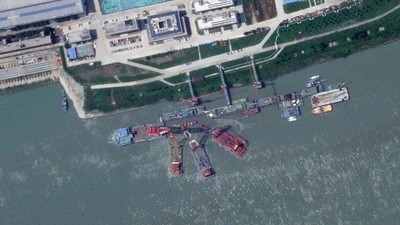 This satellite image from Planet Labs PBC shows what appears to be a sunken Chinese submarine at a shipyard near Wuhan, China, June 15, 2024. (Planet Labs PBC via AP) This satellite image from Planet Labs PBC shows what appears to be a sunken Chinese submarine at a shipyard near Wuhan, China, June 15, 2024. (Planet Labs PBC via AP)