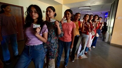 Miranda House, DU students along with their identity cards pose for photographs as they wait to cast their vote during the Delhi University Students Union Elections. (Raj k Raj) Miranda House, DU students along with their identity cards pose for photographs as they wait to cast their vote during the Delhi University Students Union Elections. (Raj k Raj)