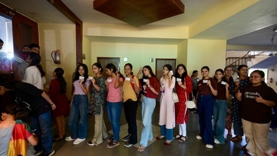 Delhi University students with their ID card waiting outside the voting centre for DUSU polls. (Raj k Raj) Delhi University students with their ID card waiting outside the voting centre for DUSU polls. (Raj k Raj)