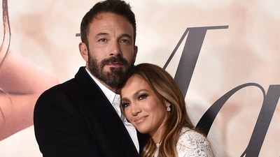 Cast member Jennifer Lopez, right, and Ben Affleck attend a photo call for a special screening of "Marry Me" on Feb. 8, 2022, in Los Angeles. (Jordan Strauss/Invision/AP)