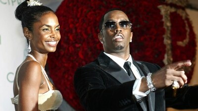 Sean "P. Diddy" Combs directs photographers as they sing "Happy Birthday," to him as his date Kim Porter, left, listens, after Combs arrived for his 35th birthday celebration at Cipriani on Wall Street in New York, Nov. 4, 2004. (AP) Sean "P. Diddy" Combs directs photographers as they sing "Happy Birthday," to him as his date Kim Porter, left, listens, after Combs arrived for his 35th birthday celebration at Cipriani on Wall Street in New York, Nov. 4, 2004. (AP)