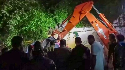 Rescue operation underway after a wall near the Mahakal temple collapses due to heavy rains, in Ujjain, Friday, Sept. 27, 2024. (PTI Photo) (PTI) Rescue operation underway after a wall near the Mahakal temple collapses due to heavy rains, in Ujjain, Friday, Sept. 27, 2024. (PTI Photo) (PTI)