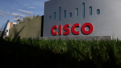 Cisco's Chennai facility opens with a multi-year investment plan to enhance production capabilities. The site, developed with Flex, aims to generate USD 1.3 billion yearly and create 1,200 jobs, focusing on advanced routing technology. (AFP) Cisco's Chennai facility opens with a multi-year investment plan to enhance production capabilities. The site, developed with Flex, aims to generate USD 1.3 billion yearly and create 1,200 jobs, focusing on advanced routing technology. (AFP)