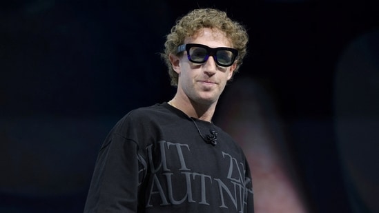 Meta CEO Mark Zuckerberg tries on Orion AR glasses at the Meta Connect annual event. (REUTERS)