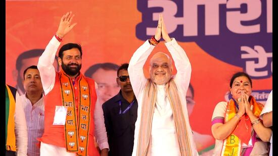 Union home minister Amit Shah with Haryana CM Nayab Singh Saini at Mullana in Ambala district of Haryana on Friday. (PTI)