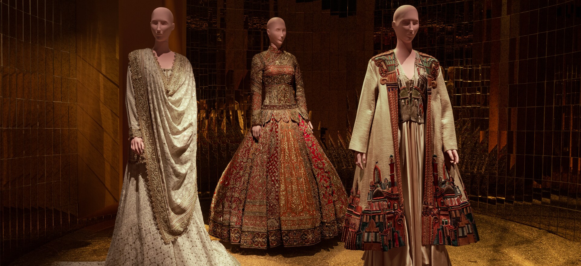 Three of the four pieces displayed as part of NMACC’s inaugural exhibition, including the architectural coat from 1990 (above, right), inspired by Delhi’s Purana Quila.