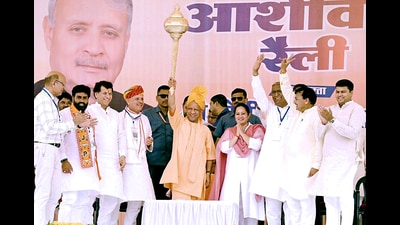 Chief minister Yogi Adityanath holds a mace during a public rally for the Haryana Assembly elections, at Ateli Assembly constituency in Mahendragarh on Saturday. (Yogi Adityanath X) Chief minister Yogi Adityanath holds a mace during a public rally for the Haryana Assembly elections, at Ateli Assembly constituency in Mahendragarh on Saturday. (Yogi Adityanath X)