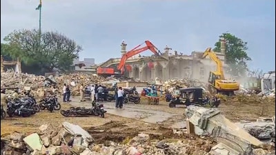 Excavators being used to demolish illegal settlements near Somnath Temple, in Gir-Somnath district of Gujarat on Saturday. (PTI) Excavators being used to demolish illegal settlements near Somnath Temple, in Gir-Somnath district of Gujarat on Saturday. (PTI)