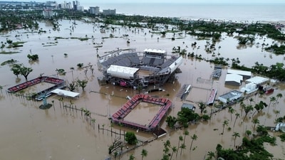 Aerial view of the flooded Arena GNP tennis court following Hurricane John in Acapulco, Guerrero State, Mexico. Mexican troops scrambled Friday to help victims of a hurricane that battered the Pacific coast, including the beach resort of Acapulco, which is still recovering from a devastating storm last year. (Photo by Francisco ROBLES / AFP) Aerial view of the flooded Arena GNP tennis court following Hurricane John in Acapulco, Guerrero State, Mexico. Mexican troops scrambled Friday to help victims of a hurricane that battered the Pacific coast, including the beach resort of Acapulco, which is still recovering from a devastating storm last year. (Photo by Francisco ROBLES / AFP)