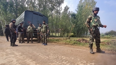 Security personnel stand guard after an encounter broke out between terrorists and security forces during cordon and search operation at Adigam village, in Kulgam district, Saturday, (PTI) Security personnel stand guard after an encounter broke out between terrorists and security forces during cordon and search operation at Adigam village, in Kulgam district, Saturday, (PTI)