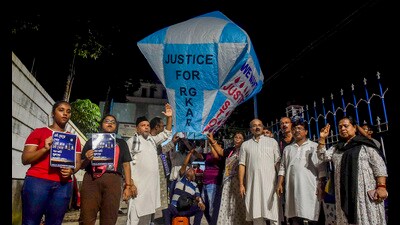 People protest against the alleged rape and murder of a junior doctor at RG Kar hospital, in Kolkata on Saturday. (PTI) People protest against the alleged rape and murder of a junior doctor at RG Kar hospital, in Kolkata on Saturday. (PTI)