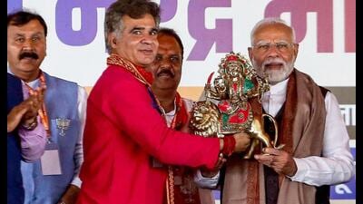 Prime Minister Narendra Modi with BJP J&K leader Ravinder Raina and others during a rally in Jammu on Saturday. (AFP) Prime Minister Narendra Modi with BJP J&K leader Ravinder Raina and others during a rally in Jammu on Saturday. (AFP)