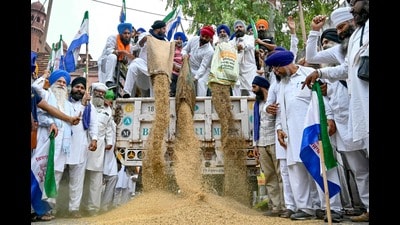 Protesting farmers dump sacks of basmati rice along a street in Amritsar on September 28, 2024. (AFP)